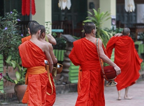 monks in luang prabang