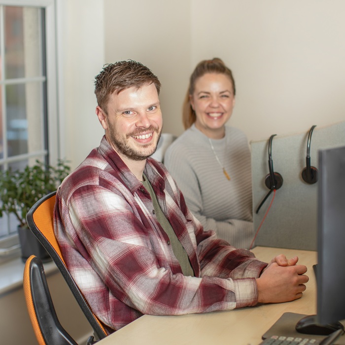 Nick and Laura Smiling eShores Office